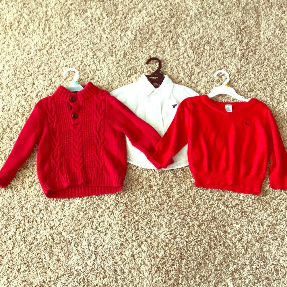 Two red sweaters and a white shirt